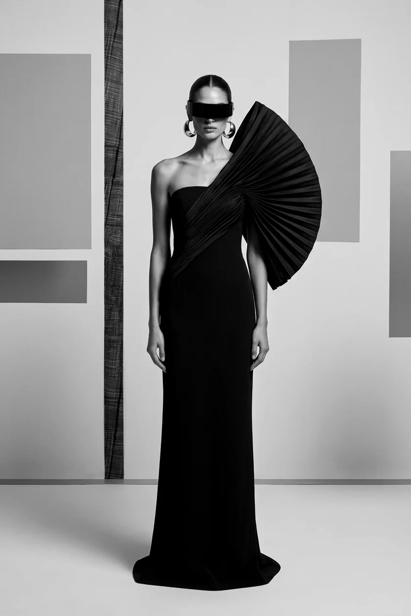 Black couture gown with architectural fan pleats